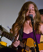 Image of Katie Elevitch performing at Vibrations 2016 a fundraiser for The Love Yourself Project